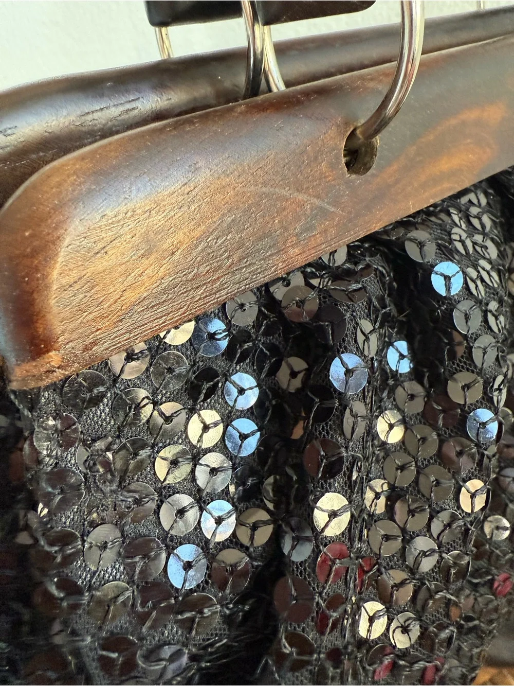 Vintage black sequin handbag with wood trim and handles.